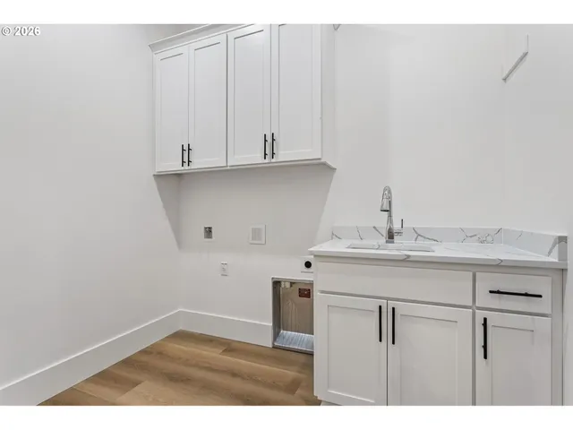 a bathroom with a sink and cabinets