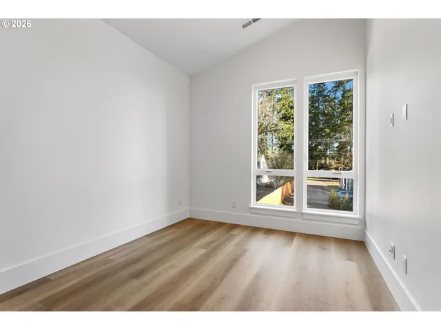 a view of wooden floor in an empty room