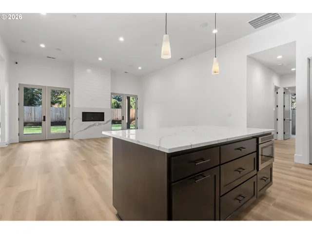 a kitchen with a sink and natural light