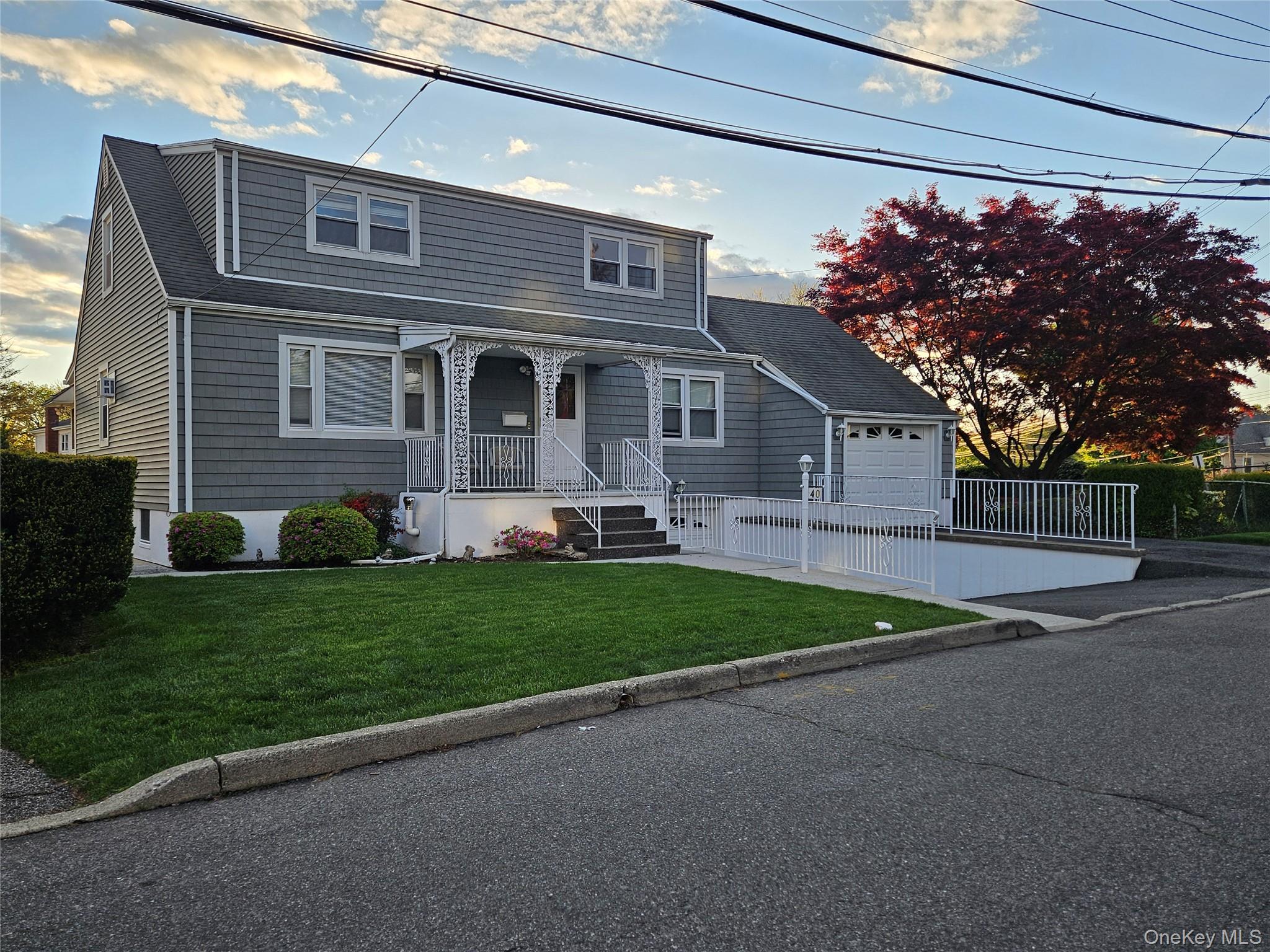 40 Division St during Sunset. Includes ONE parking space in downward driveway