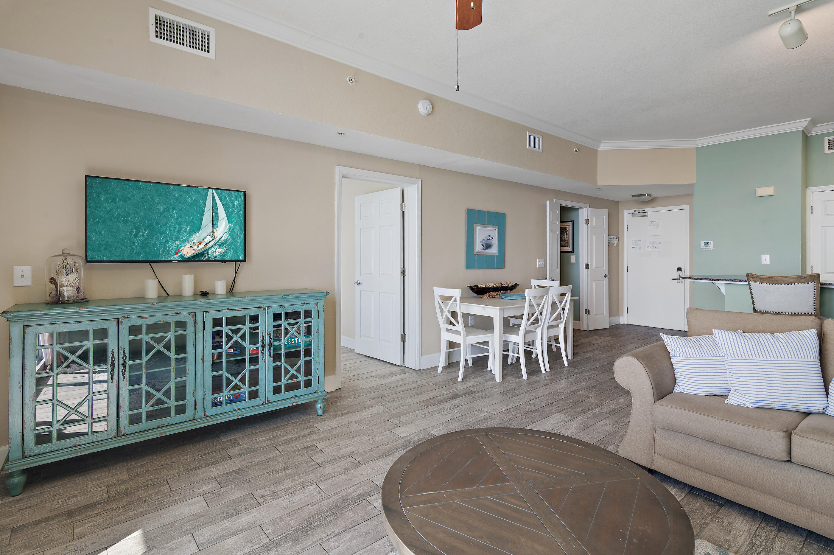 16819 Front Beach Road, Unit 2612 Panama City Beach, FL 32413 - Photo 11 of 53 a living room with furniture and flat screen tv