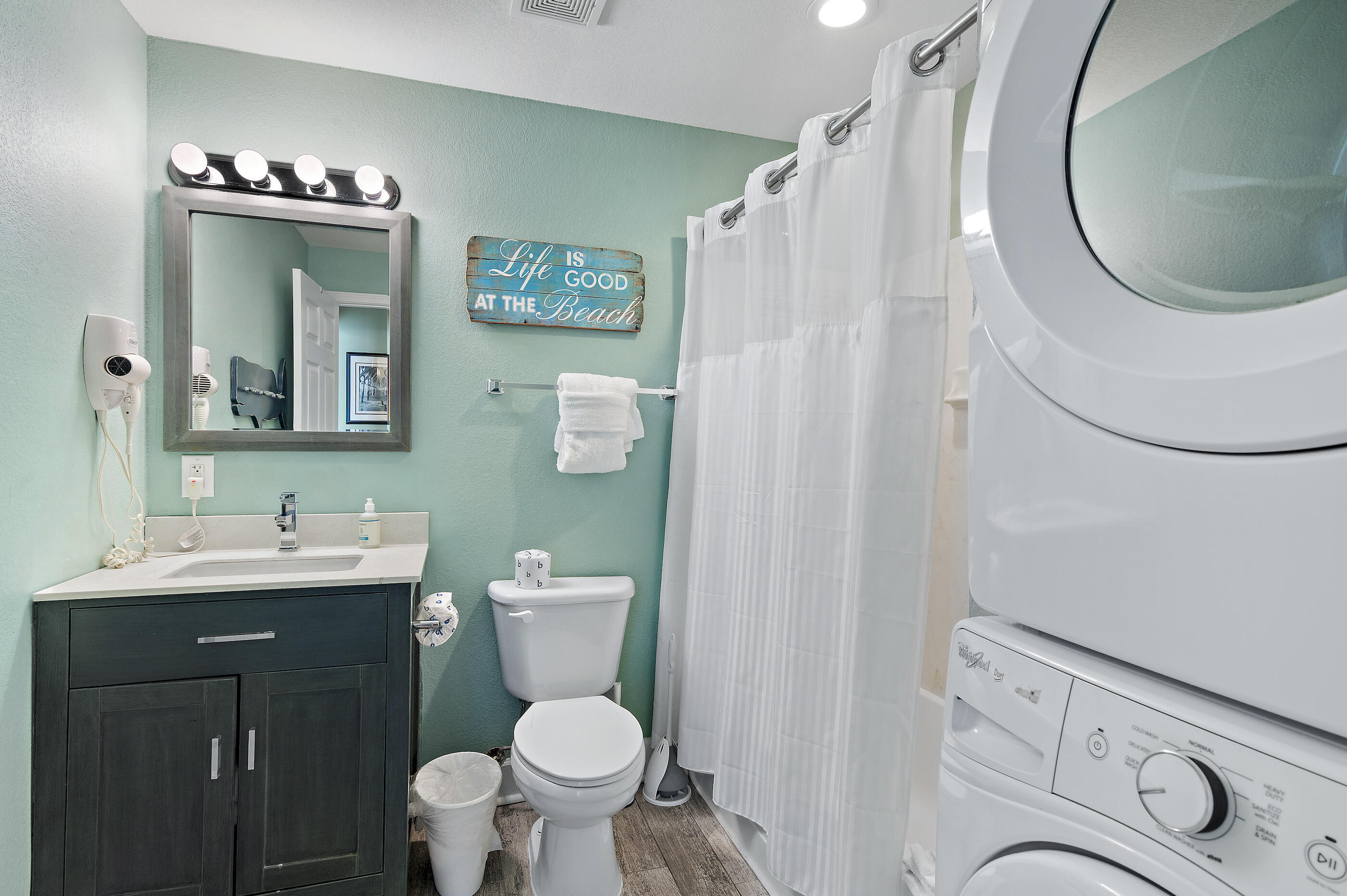 16819 Front Beach Road, Unit 2612 Panama City Beach, FL 32413 - Photo 16 of 53 a bathroom with a toilet sink and mirror