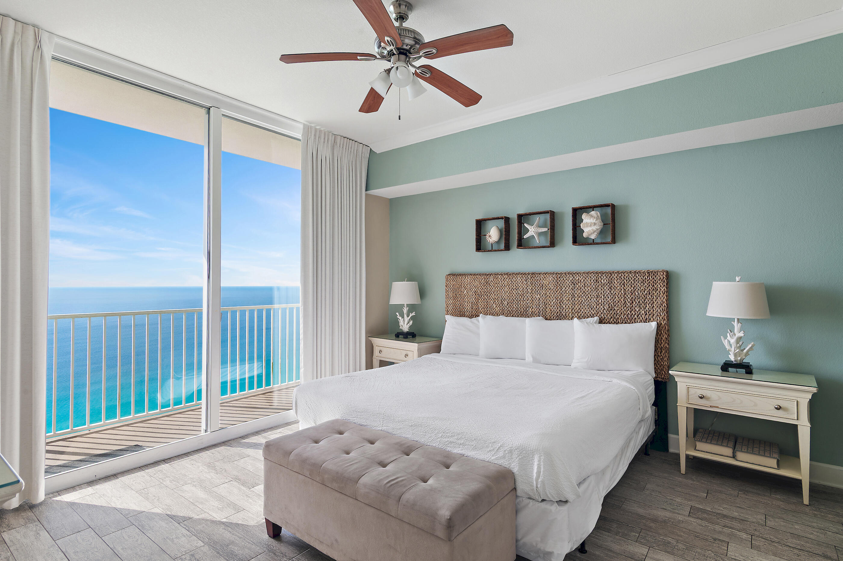 16819 Front Beach Road, Unit 2612 Panama City Beach, FL 32413 - Photo 17 of 53 a bedroom with a bed and a chandelier