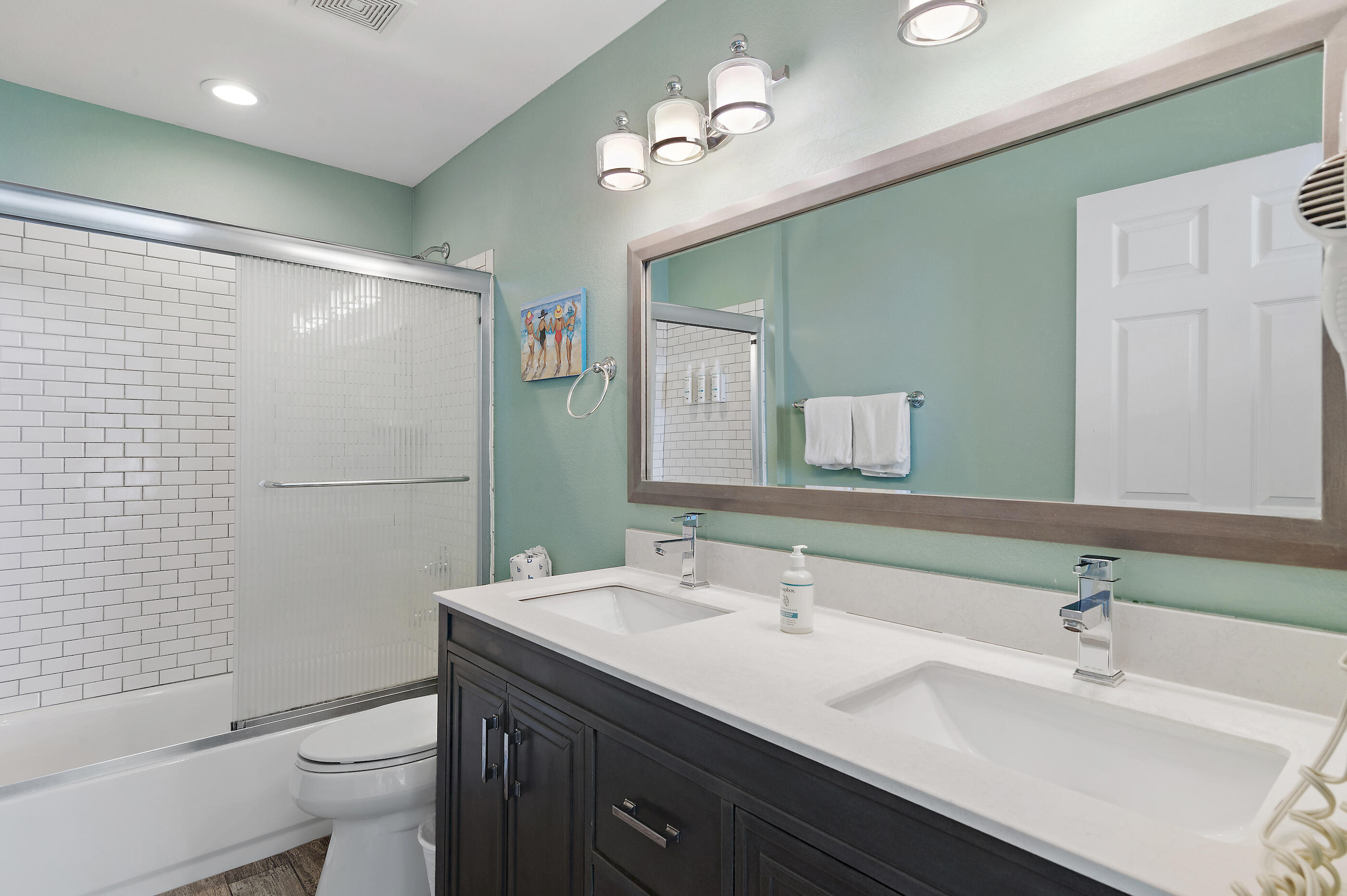 16819 Front Beach Road, Unit 2612 Panama City Beach, FL 32413 - Photo 20 of 53 a bathroom with a double vanity sink toilet and shower