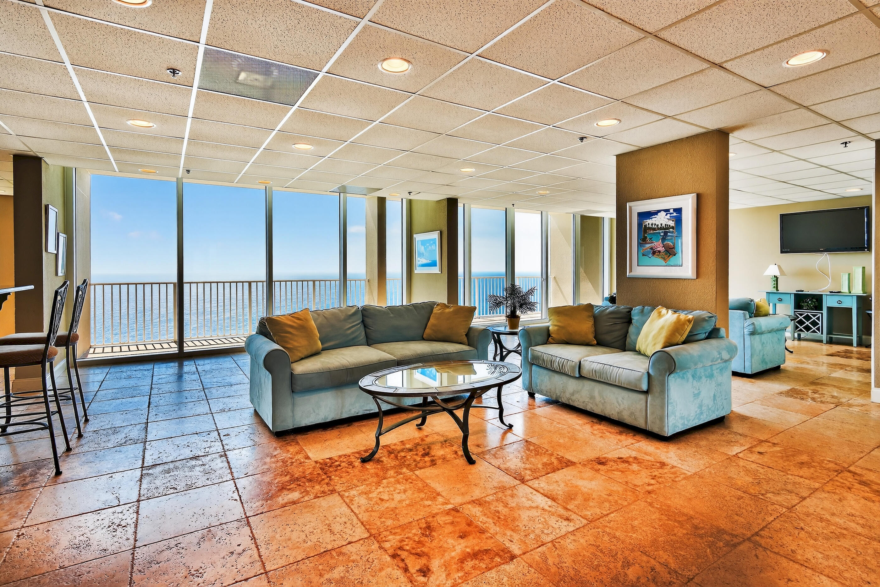 16819 Front Beach Road, Unit 2612 Panama City Beach, FL 32413 - Photo 32 of 53 a living room with furniture a wooden floor and next to a window