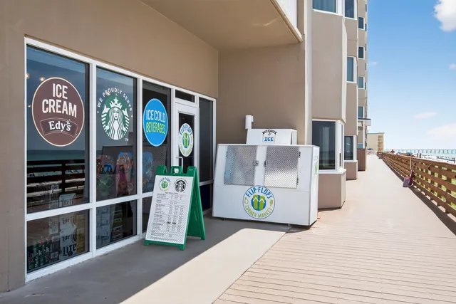 a view of a terrace with dining table and chairs