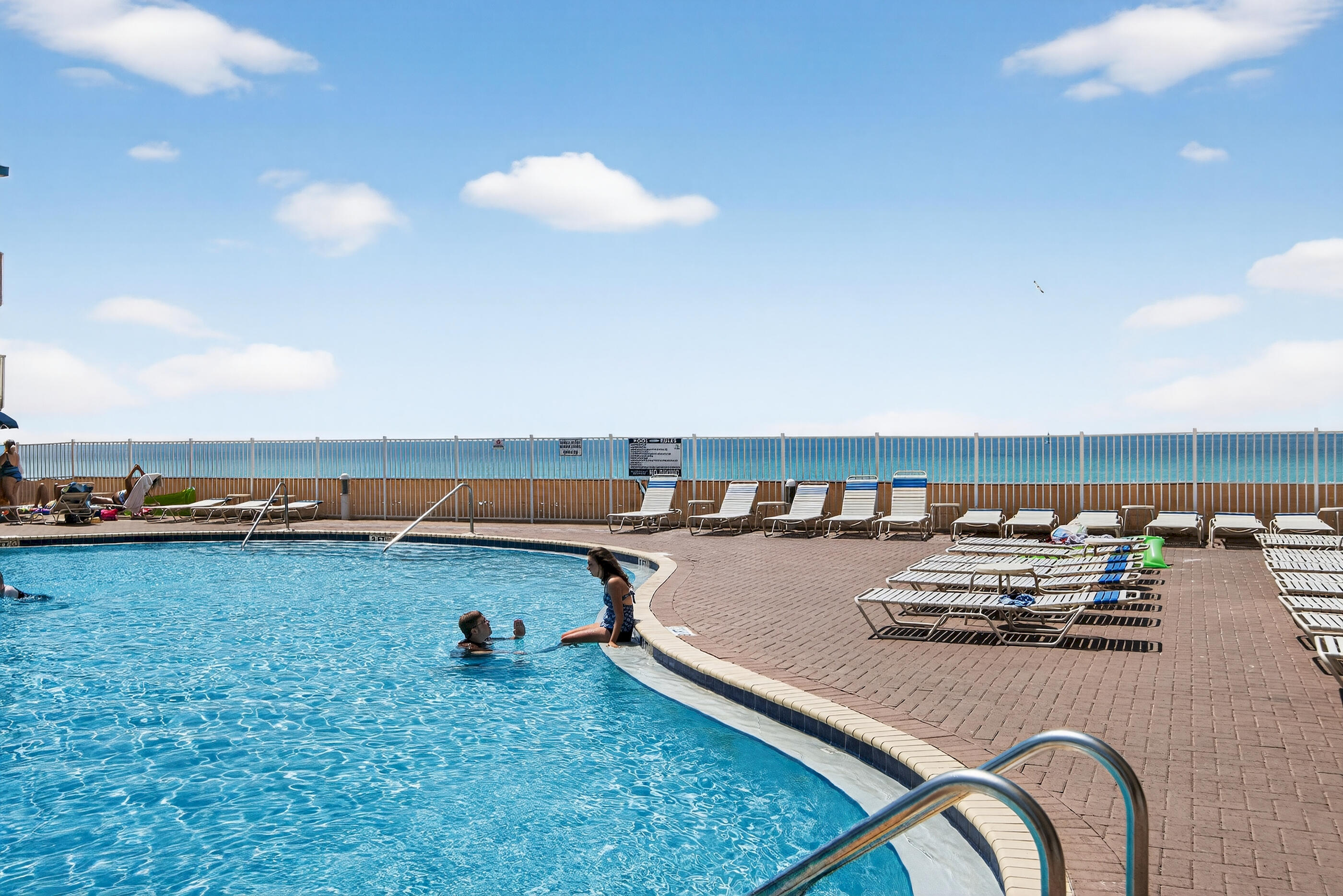 16819 Front Beach Road, Unit 2612 Panama City Beach, FL 32413 - Photo 48 of 53 a view of a terrace with dining table and chairs