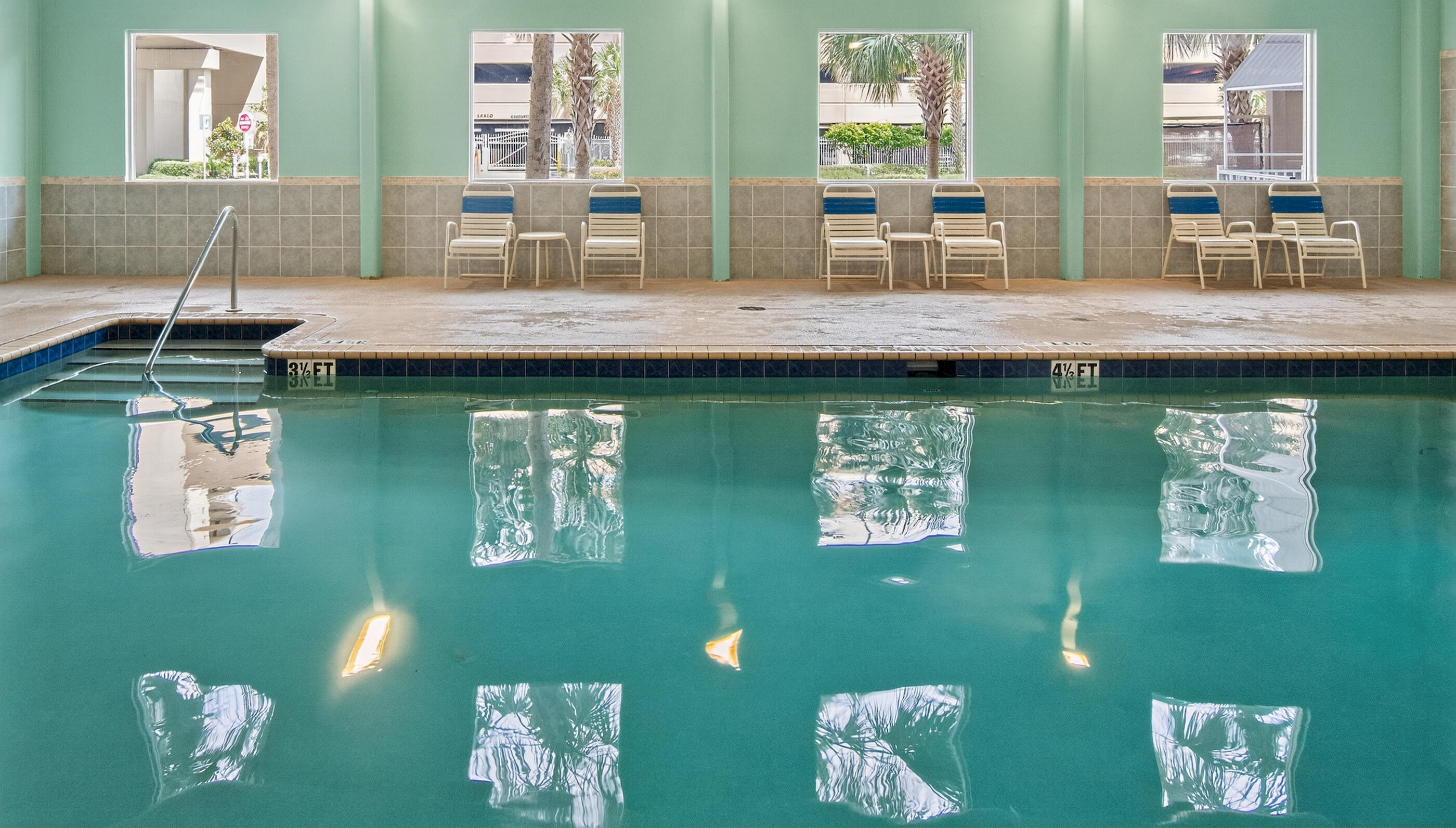 16819 Front Beach Road, Unit 2612 Panama City Beach, FL 32413 - Photo 50 of 53 a view of a dining hall with furniture and a large window