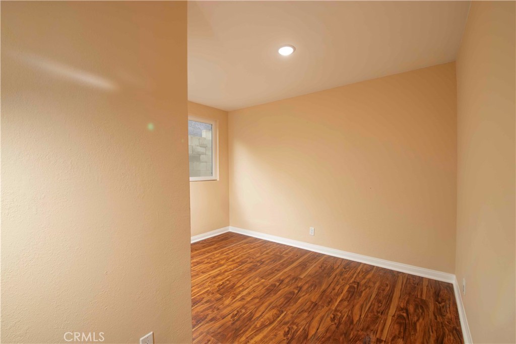 143 West 234th Place Carson, CA 90745 - Photo 15 of 46 a view of an empty room with wooden floor