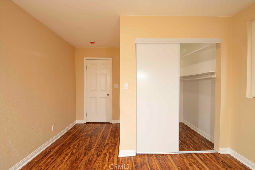 143 West 234th Place Carson, CA 90745 - Photo 16 of 46 a view of an empty room with wooden floor