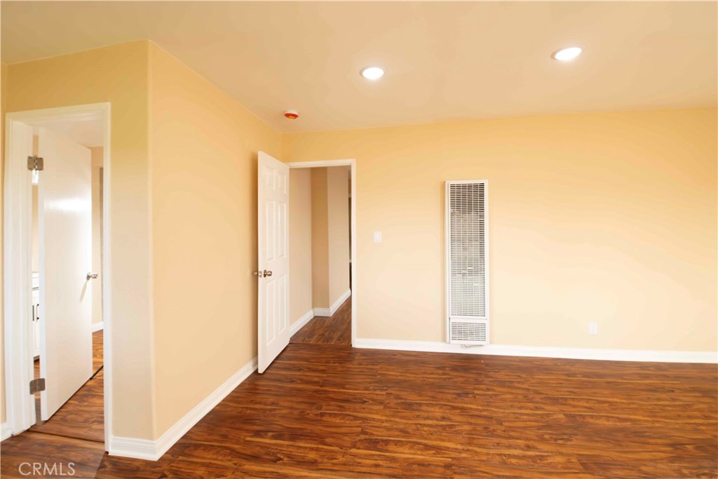 143 West 234th Place Carson, CA 90745 - Photo 19 of 46 a view of a hallway with wooden floor