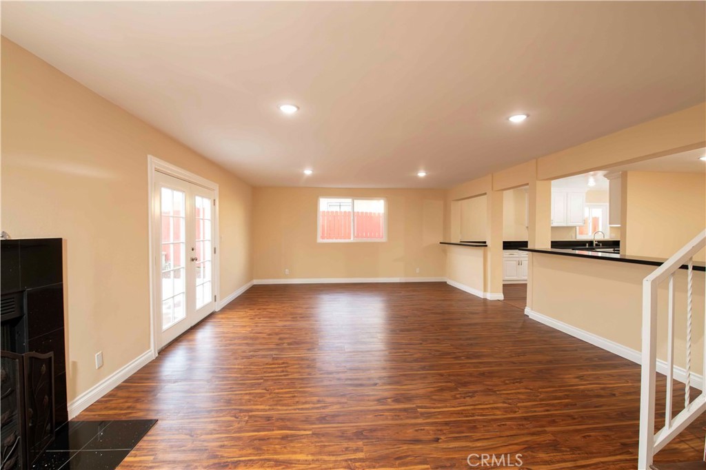 143 West 234th Place Carson, CA 90745 - Photo 20 of 46 a view of empty room with wooden floor and windows
