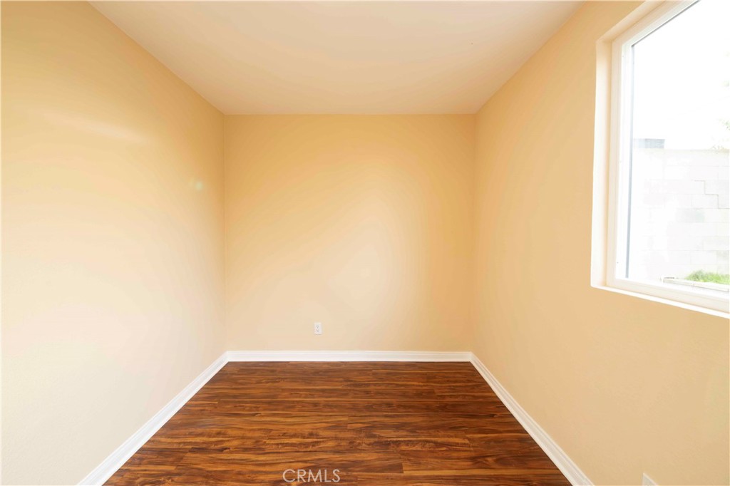 143 West 234th Place Carson, CA 90745 - Photo 21 of 46 a view of a small space with wooden floor and a window