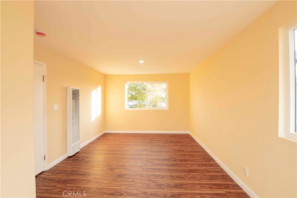 143 West 234th Place Carson, CA 90745 - Photo 23 of 46 a view of an empty room with wooden floor