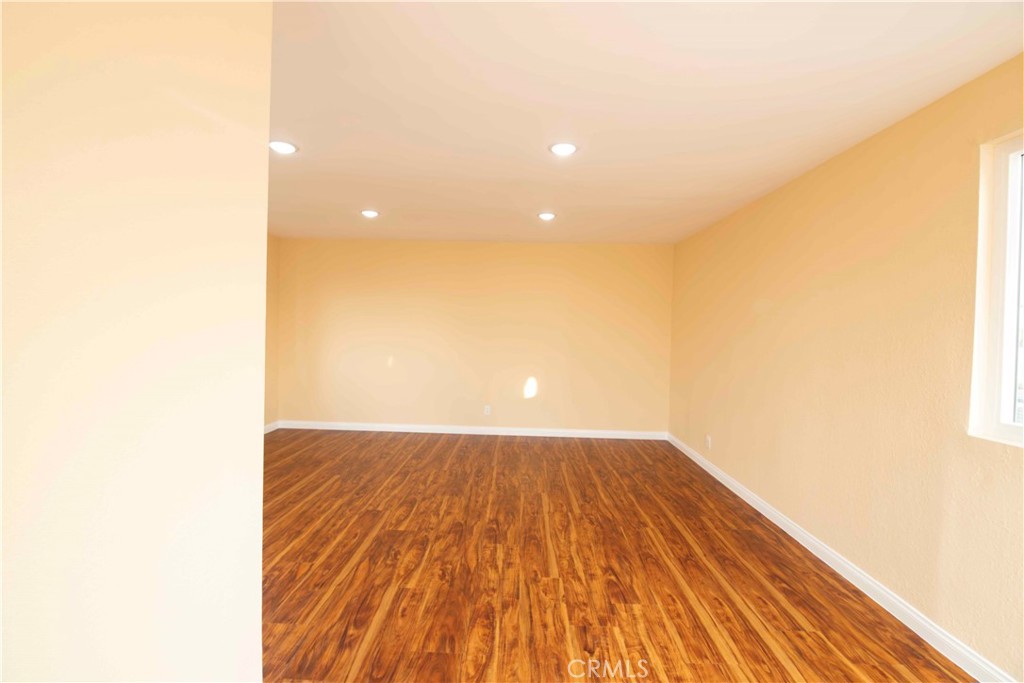143 West 234th Place Carson, CA 90745 - Photo 35 of 46 a view of an empty room and wooden floor