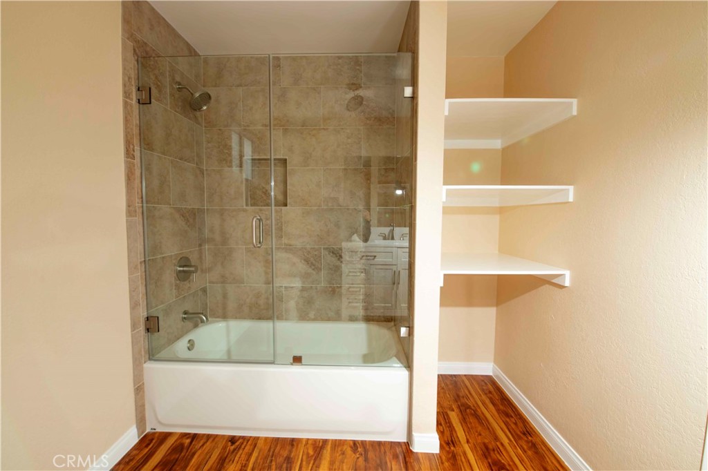 143 West 234th Place Carson, CA 90745 - Photo 39 of 46 a bathroom with a bathtub and a shower
