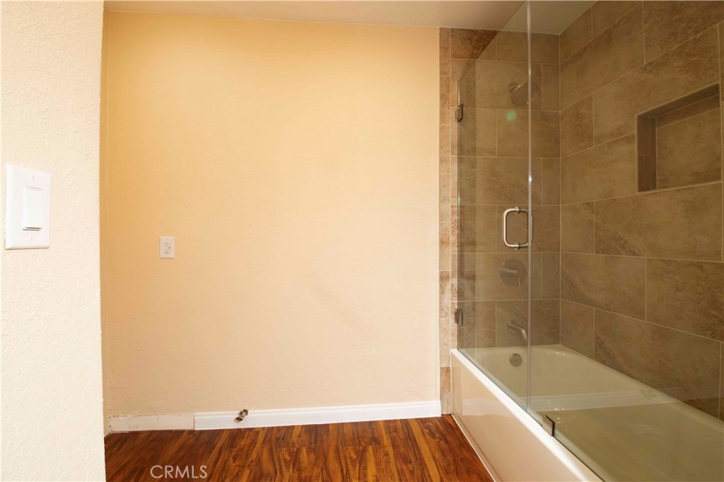 143 West 234th Place Carson, CA 90745 - Photo 43 of 46 a bathroom with a bathtub and shower