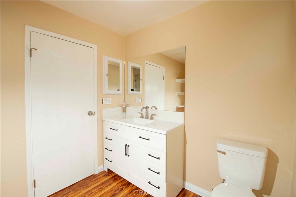 143 West 234th Place Carson, CA 90745 - Photo 46 of 46 a bathroom with a sink a toilet and a mirror