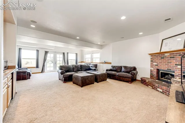 a living room with furniture fireplace and a flat screen tv