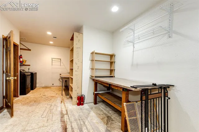 a bed room with a bed and a television