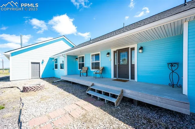 a front view of a house with barbeque area