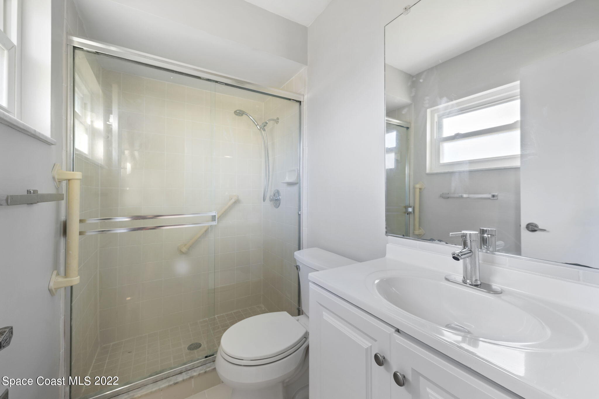 1141 Cromey Road Northeast Palm Bay, FL 32905 - Photo 19 of 27 a bathroom with a sink toilet and shower