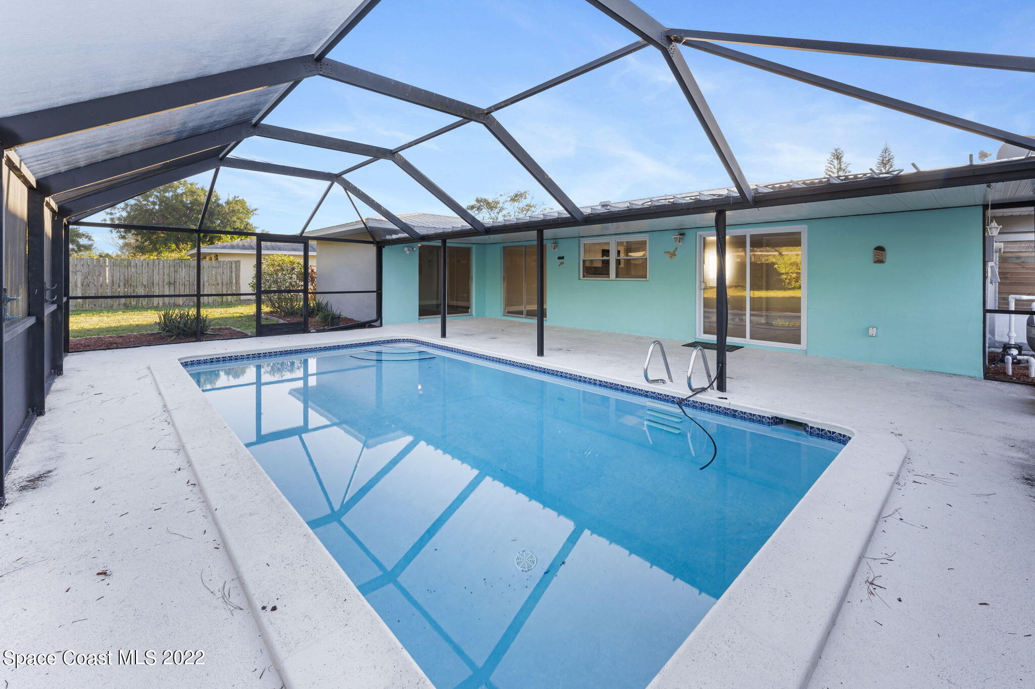 1141 Cromey Road Northeast Palm Bay, FL 32905 - Photo 21 of 27 a view of swimming pool with seating area