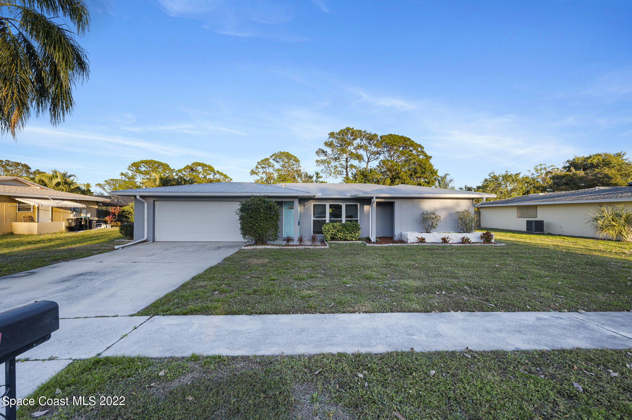 1141 Cromey Road Northeast Palm Bay, FL 32905 - Photo 23 of 27 a view of a house with a yard