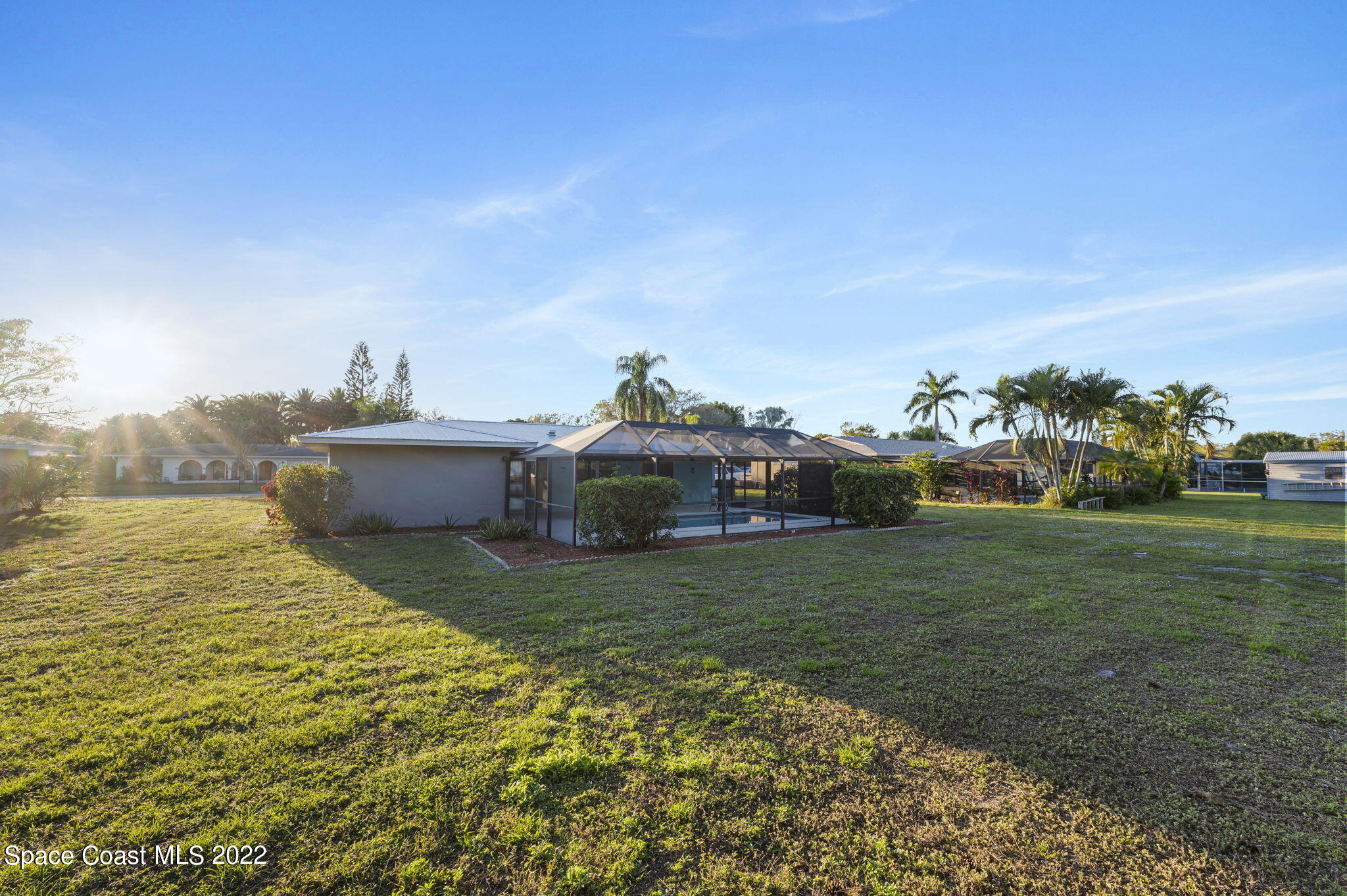 1141 Cromey Road Northeast Palm Bay, FL 32905 - Photo 26 of 27 a view of a garden and basketball court