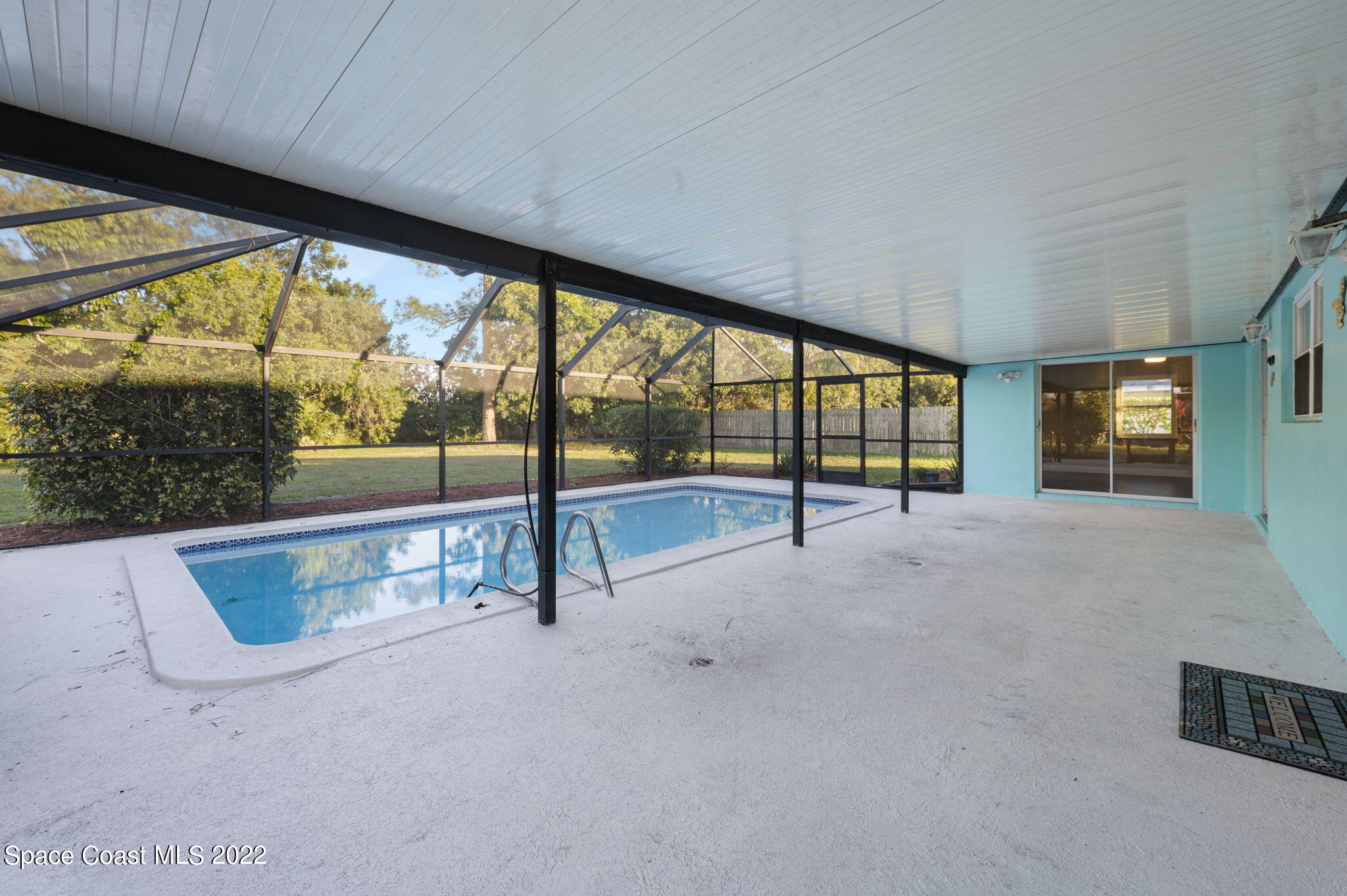1141 Cromey Road Northeast Palm Bay, FL 32905 - Photo 6 of 27 a view of an empty room with a fireplace
