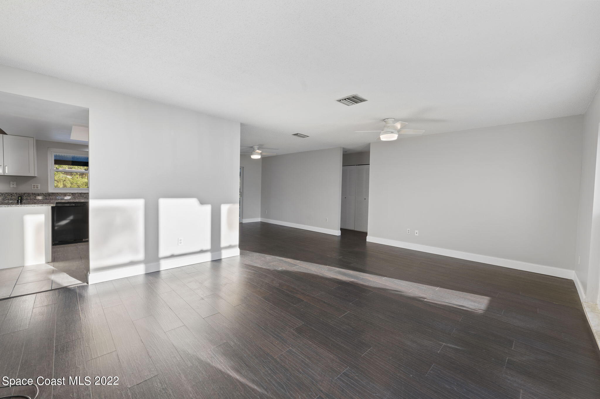 1141 Cromey Road Northeast Palm Bay, FL 32905 - Photo 7 of 27 a view of a kitchen with a sink and a fireplace