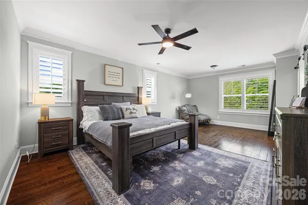 a spacious bedroom with a bed and a window