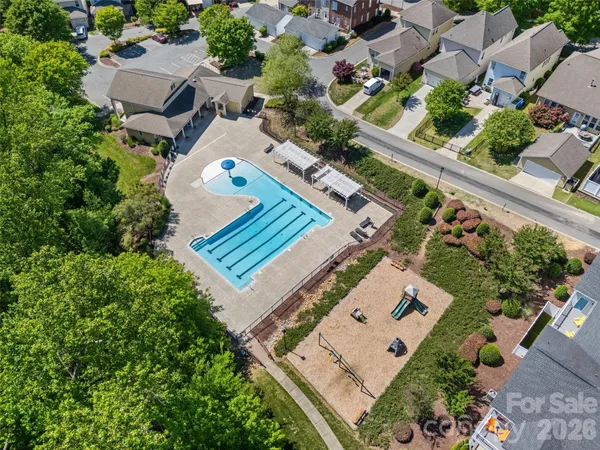 an aerial view of a house with a yard and plants