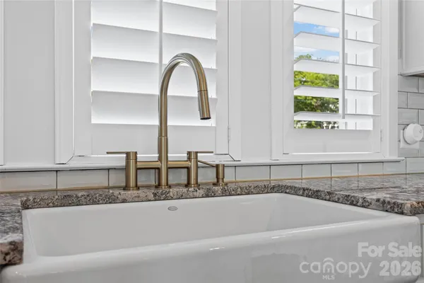 a bathroom with a bathtub and a window