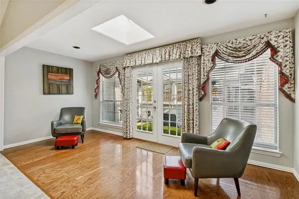 a living room with furniture and a rug