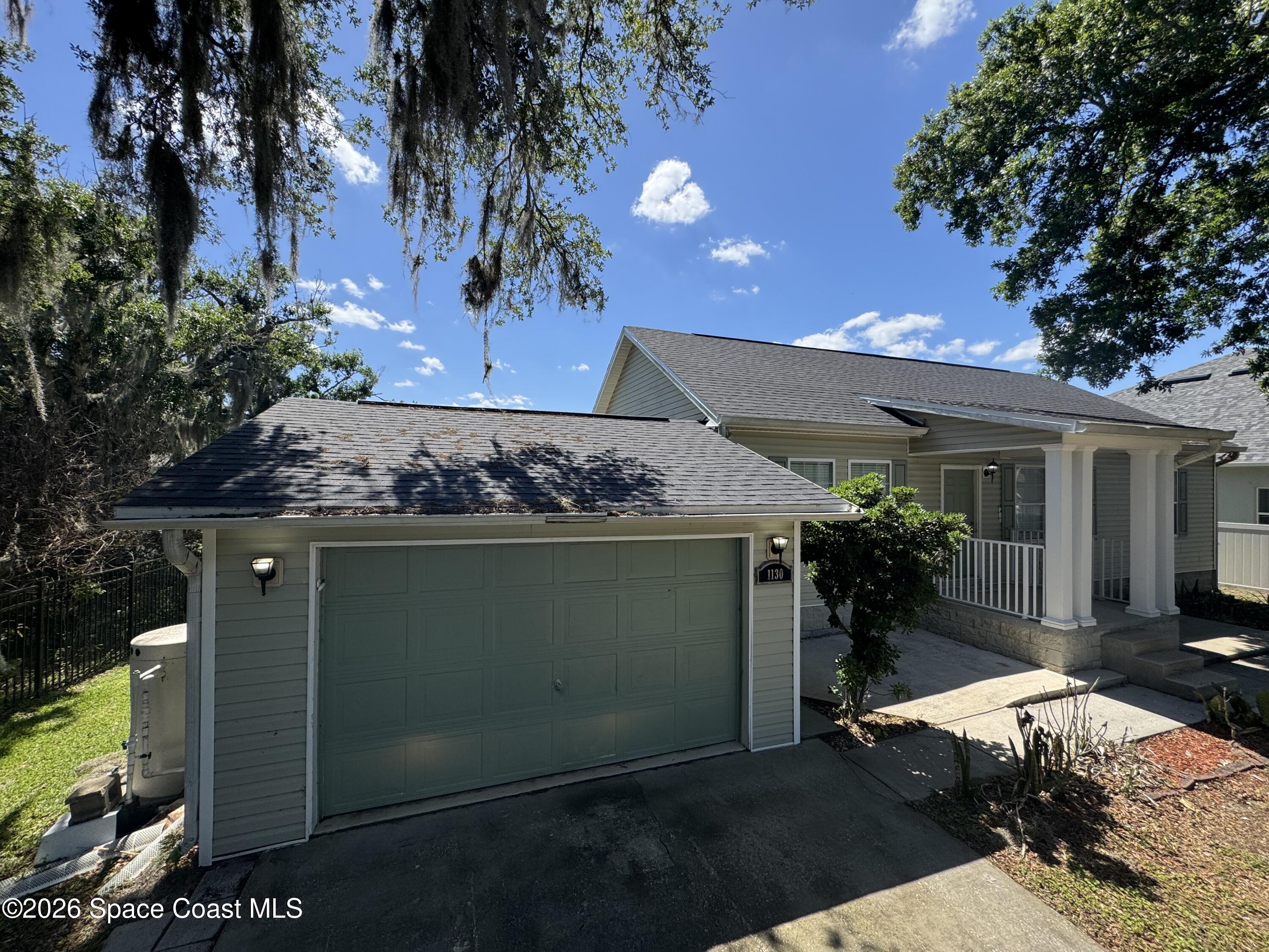 1130 Grapefruit Road Southeast Palm Bay, FL 32909 - Photo 1 of 14 a view of a entryway of the house