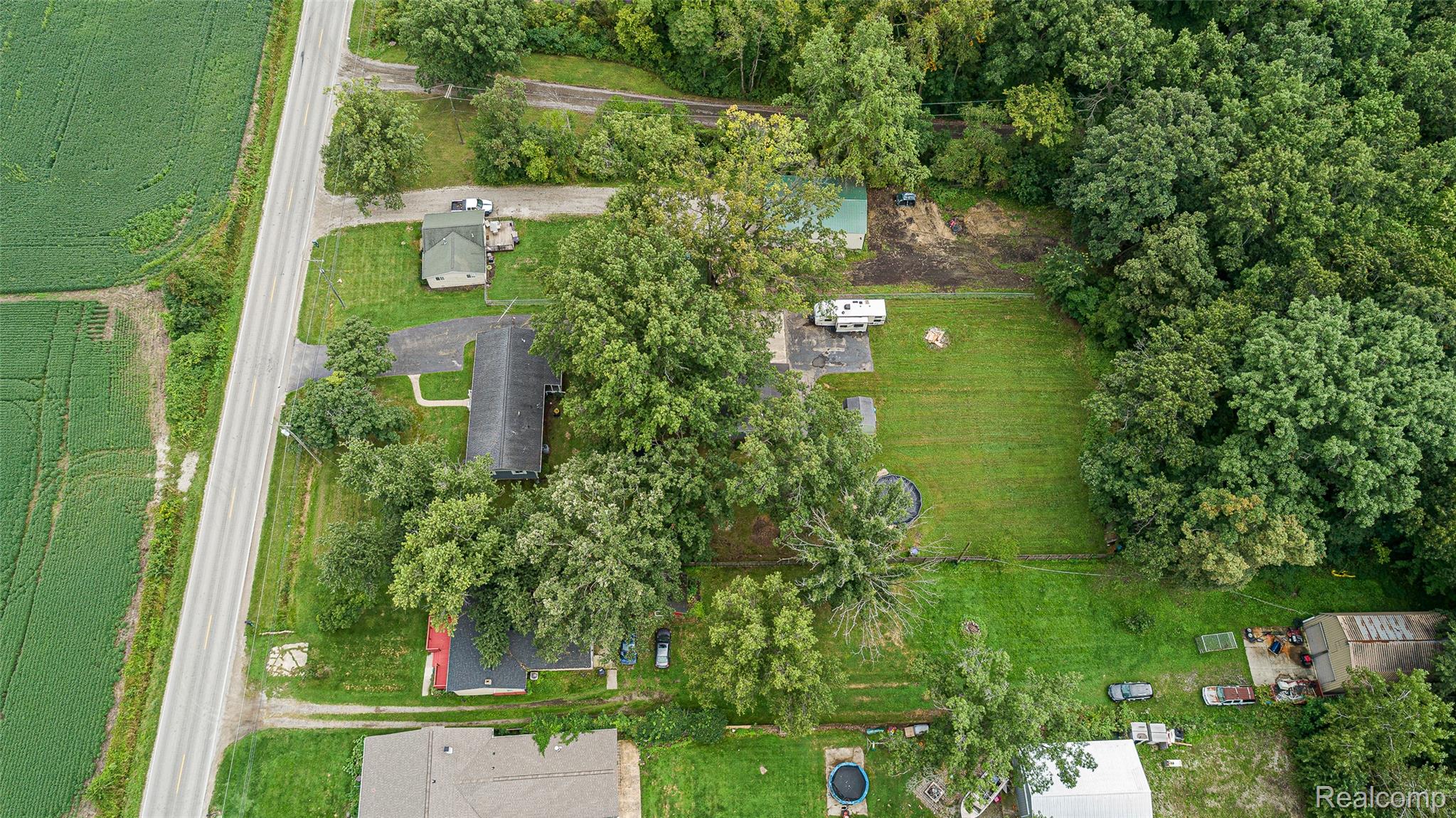 9561 Exeter Road Carleton, MI 48117 - Photo 7 of 46 Expansive green space and mature trees define the property