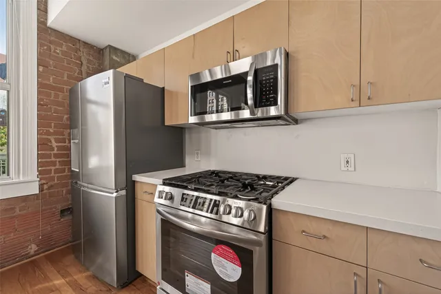 a kitchen with a sink and a window
