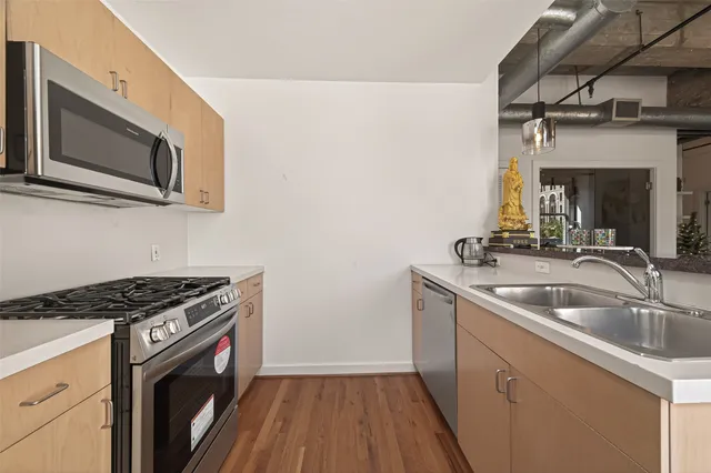 a spacious bedroom with a large bed and a large window