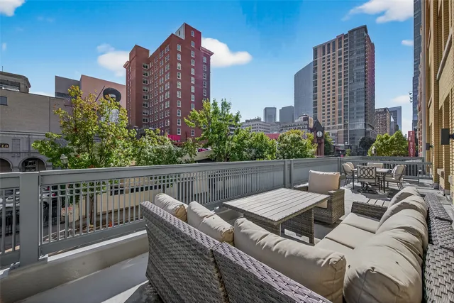 a view of a balcony with furniture