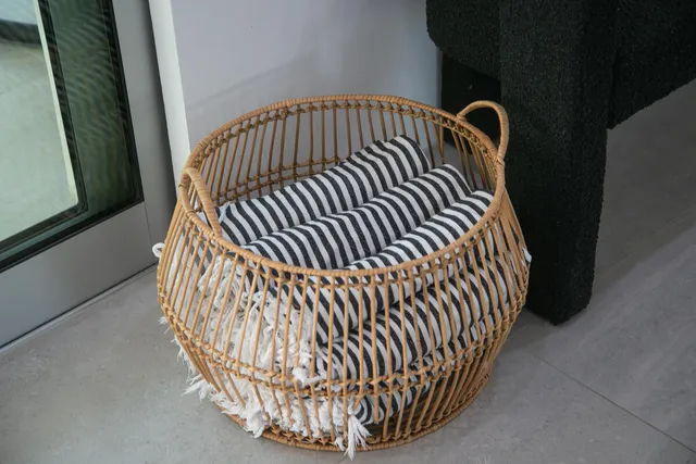 a living room with furniture and kitchen view