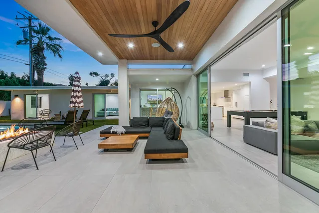 a front view of a house with a garden and plants