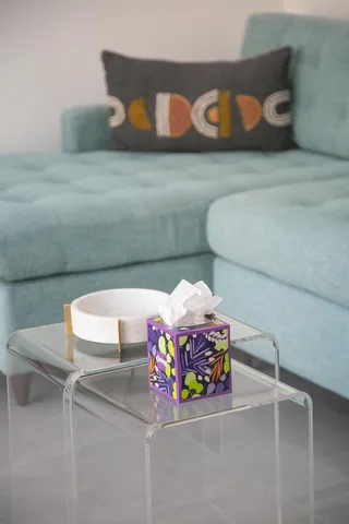 a bedroom with a bed and two lamp