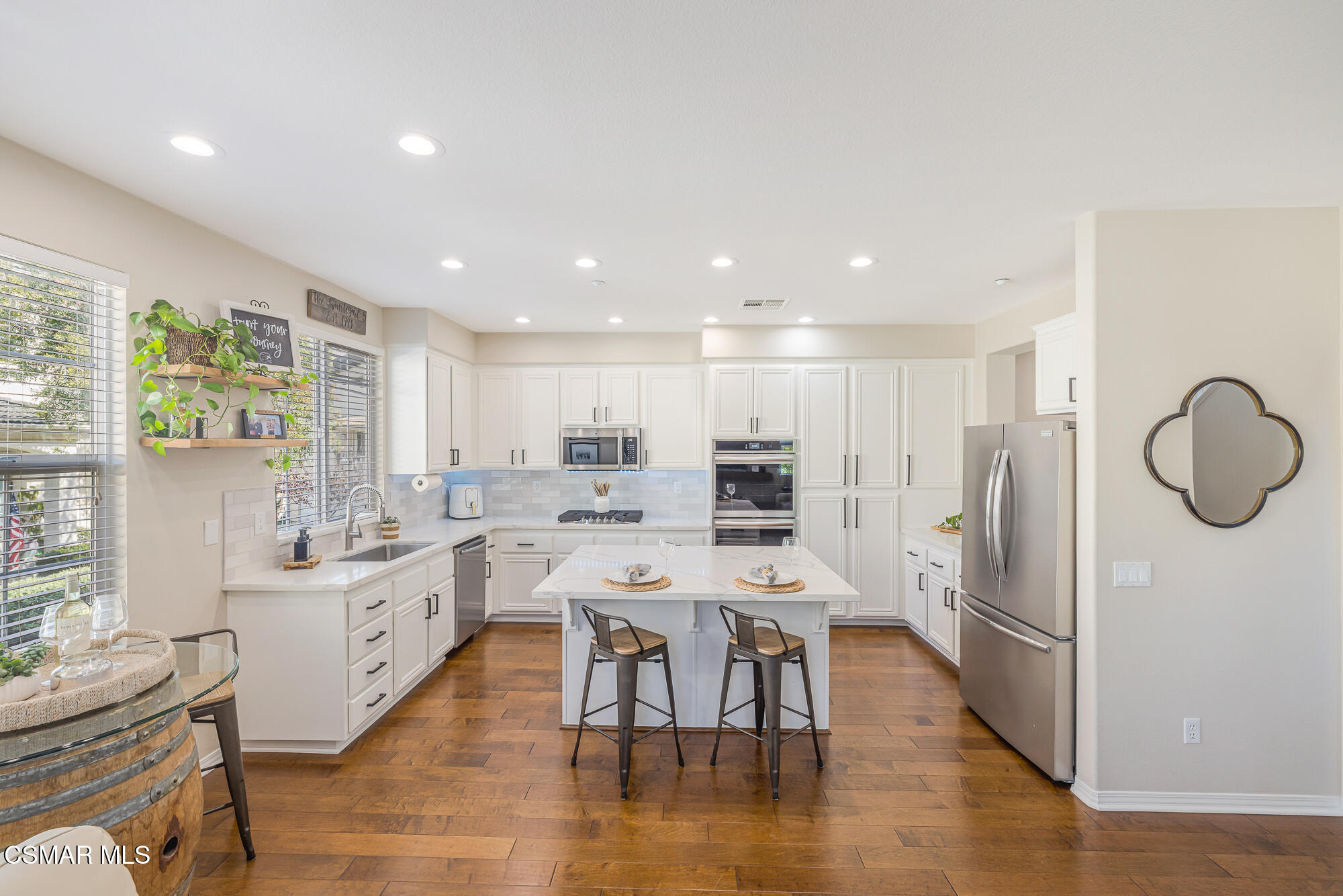 1240 Bayside Lane Oxnard, CA 93035 - Photo 18 of 51 a large kitchen with a table and chairs