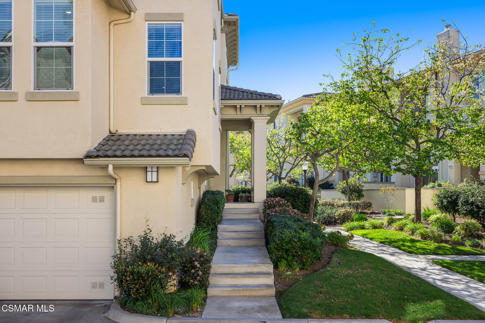 1240 Bayside Lane Oxnard, CA 93035 - Photo 2 of 51 a front view of a house with garden