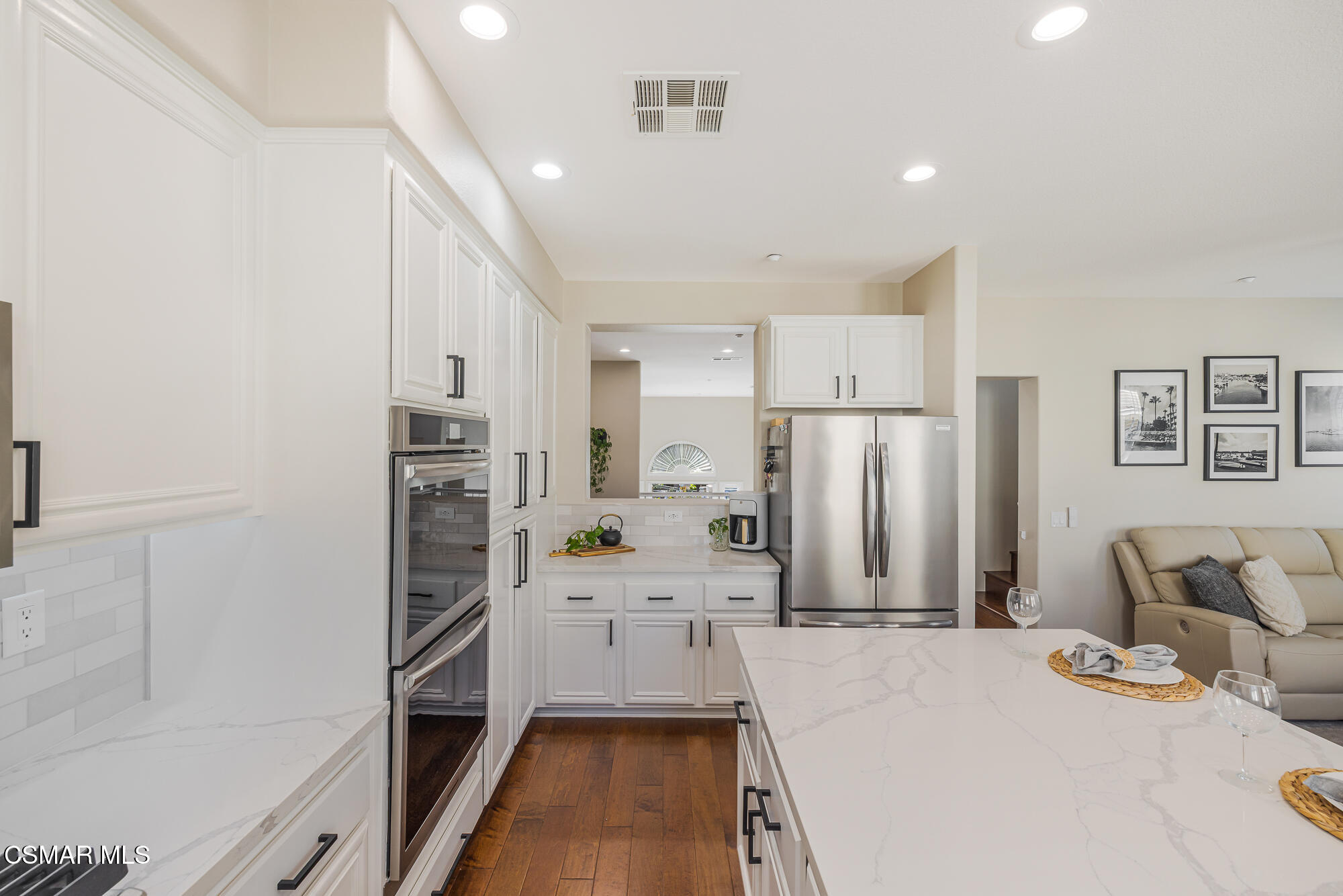 1240 Bayside Lane Oxnard, CA 93035 - Photo 21 of 51 a kitchen with stainless steel appliances a refrigerator and a stove top oven