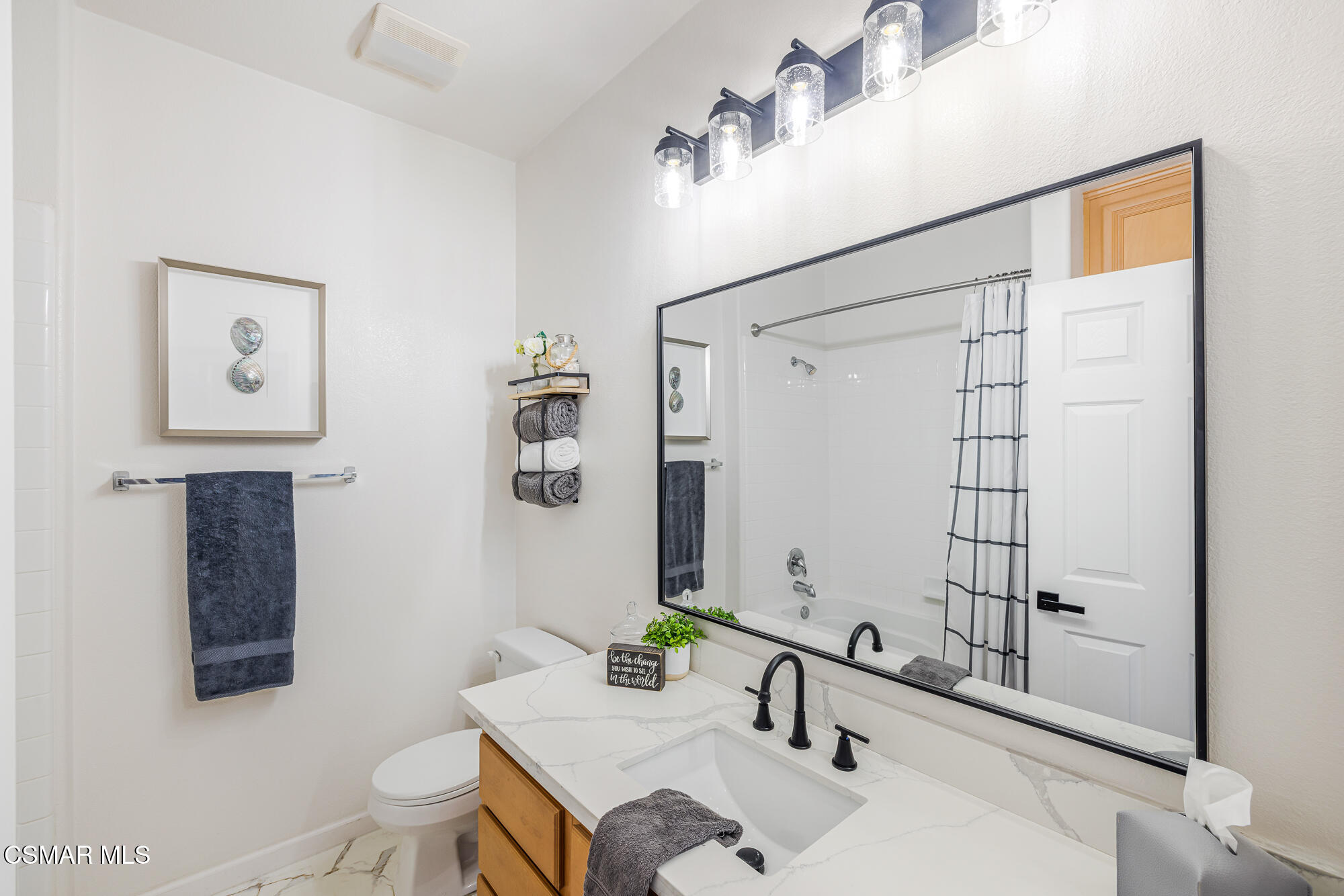 1240 Bayside Lane Oxnard, CA 93035 - Photo 25 of 51 a bathroom with a sink and a mirror
