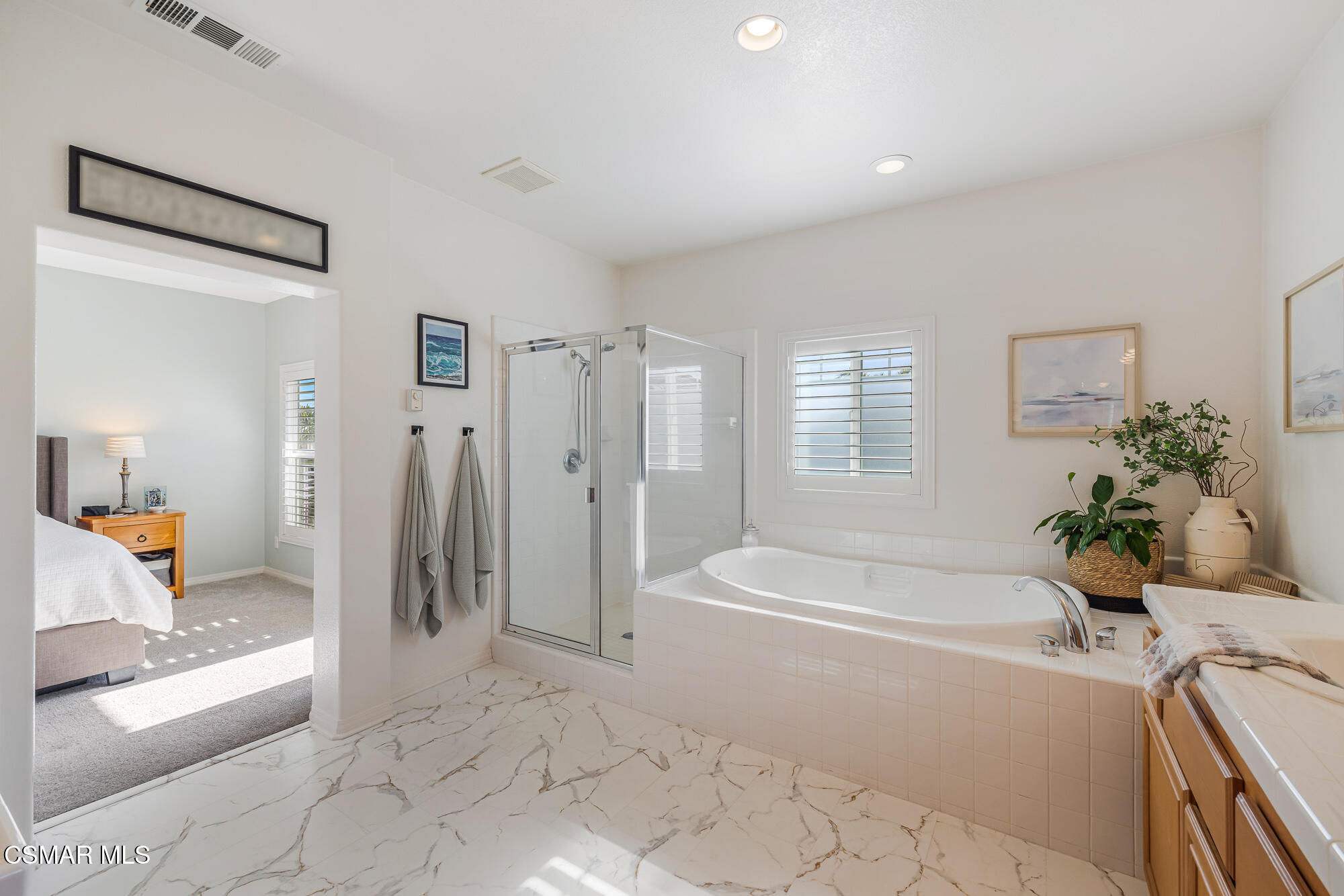 1240 Bayside Lane Oxnard, CA 93035 - Photo 32 of 51 a spacious bathroom with a tub shower and windows