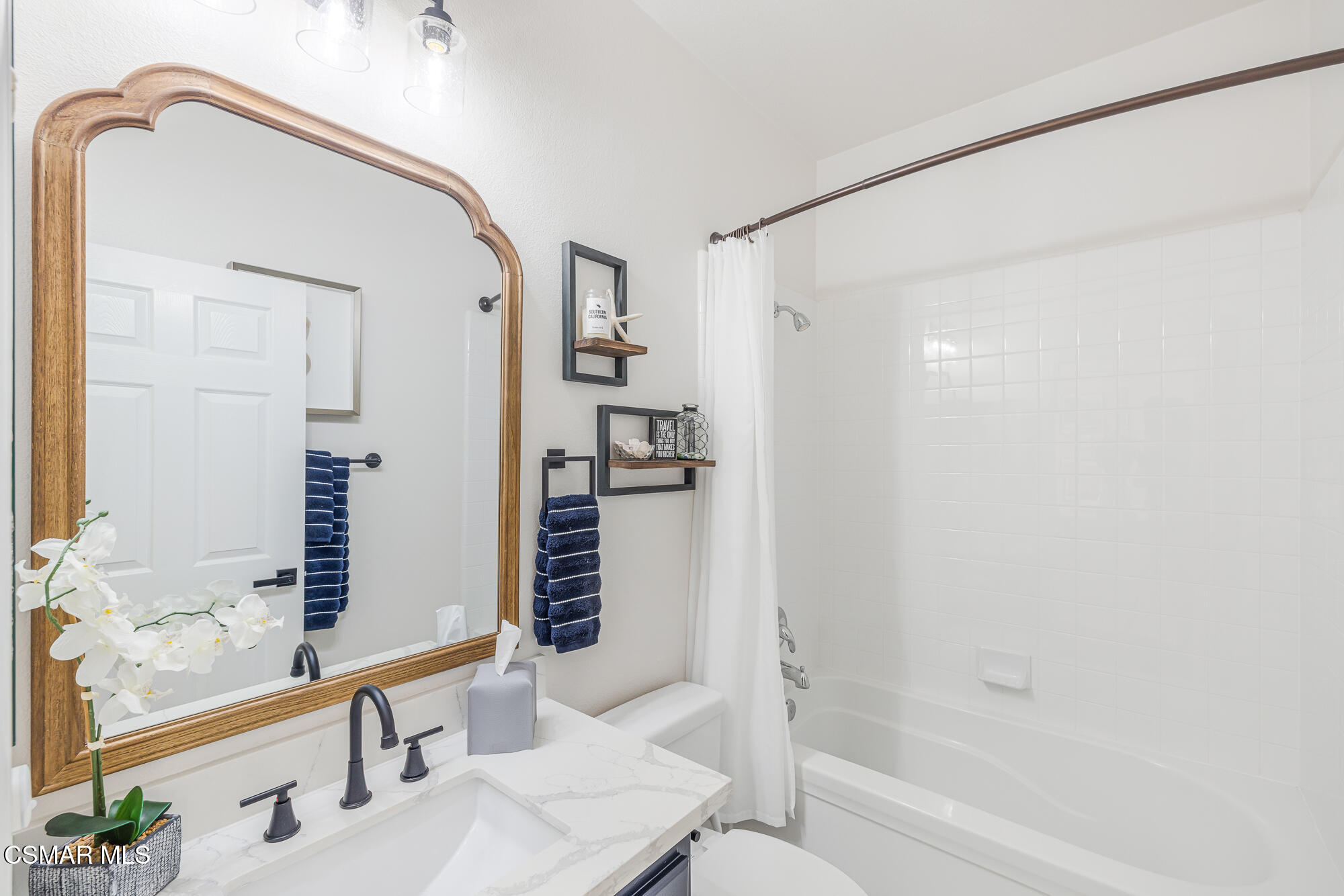 1240 Bayside Lane Oxnard, CA 93035 - Photo 7 of 51 a bathroom with a bathtub and a sink