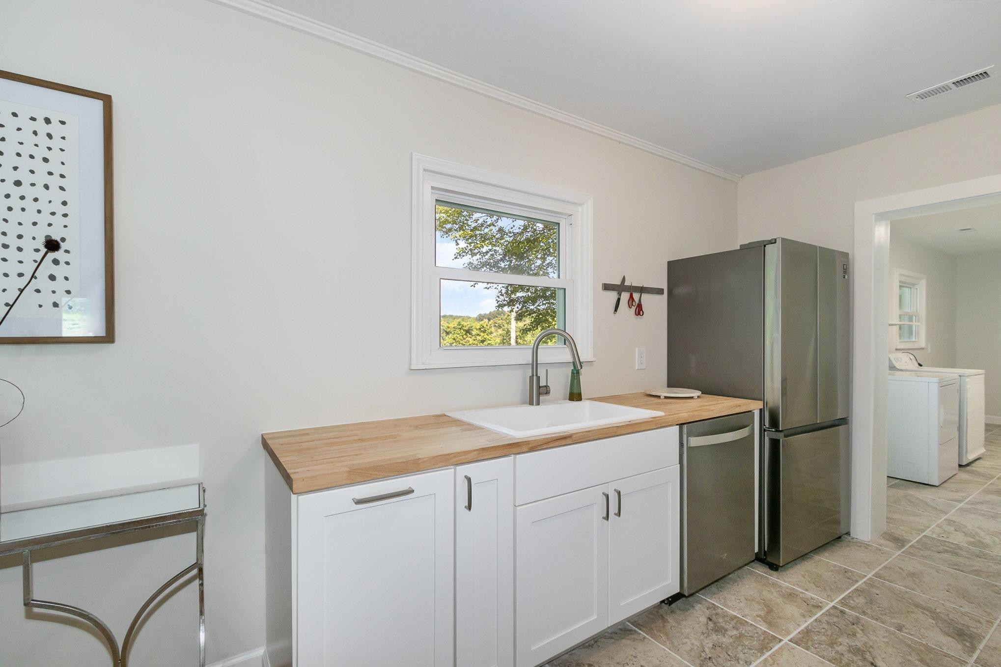 10611 Rougemont Road Bahama, NC 27503 - Photo 11 of 66 a room with a sink cabinets and refrigerator